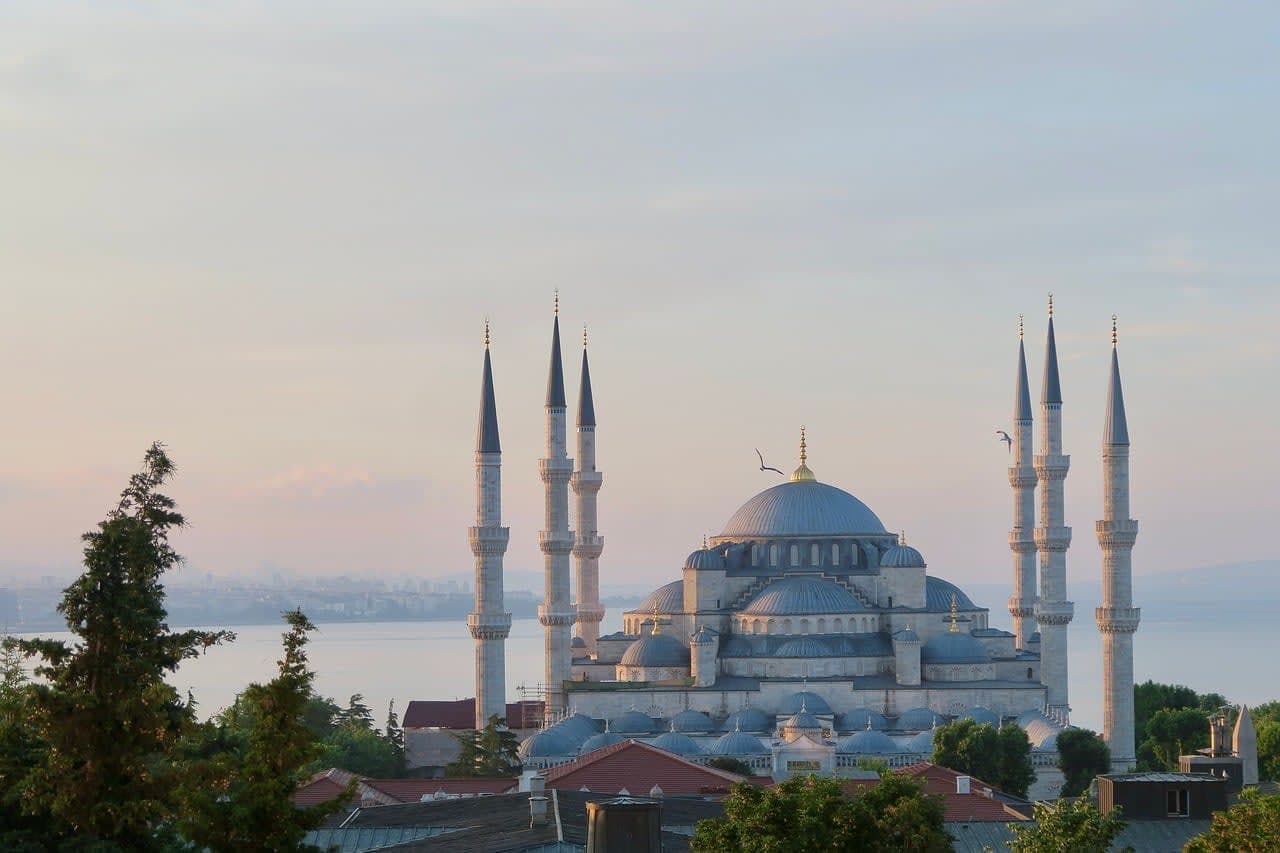 Istanbul skyline with a historic mosque at dawn