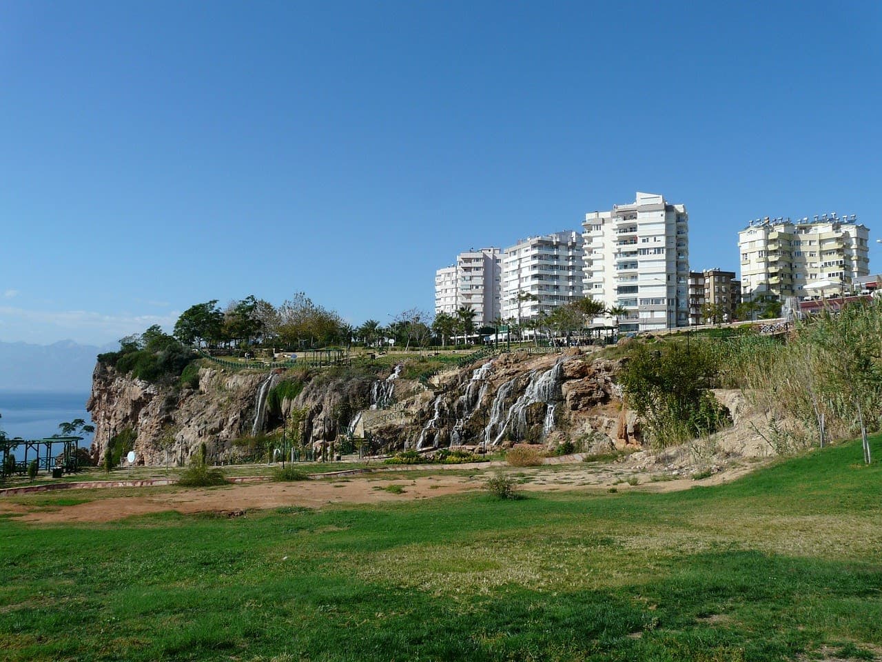 Apartment blocks beside a waterfall park on the Antalya coast