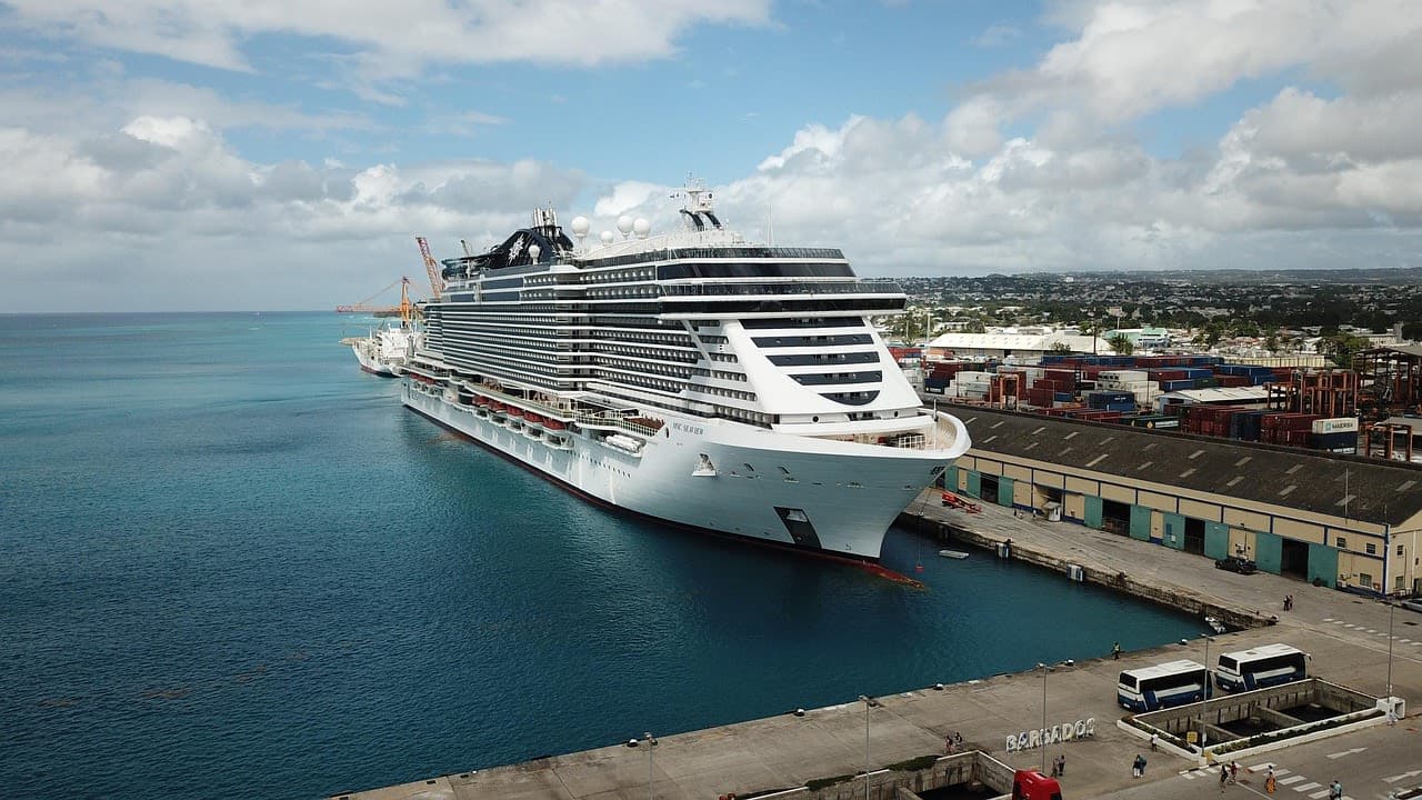 A cruise ship alongside a Caribbean port, seen from above